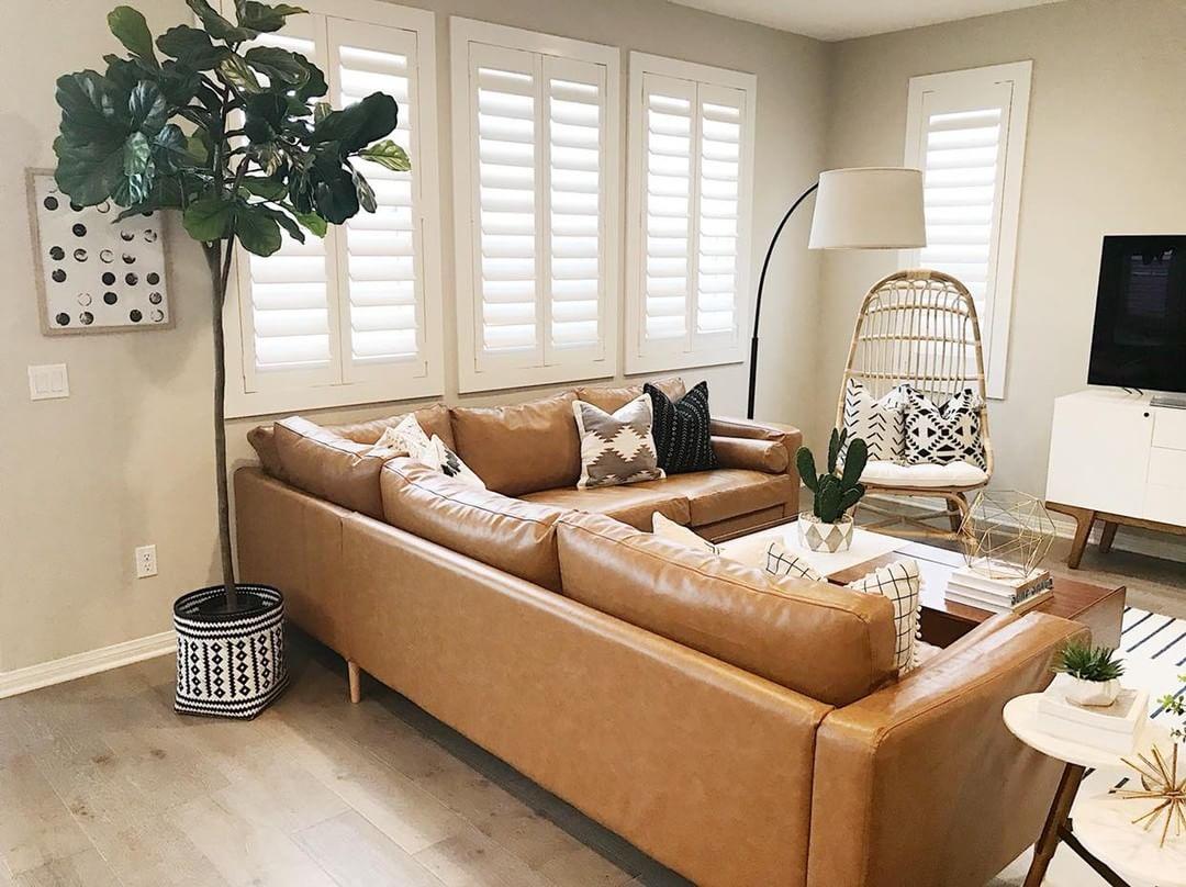 Warm living room with our Polywood shutters in Fort Myers.